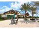 Community pool with patio tables and lounge seating at 14636 Newtonmore Ln, Lakewood Ranch, FL 34202