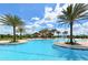Stunning pool with a clubhouse and palm trees at 14636 Newtonmore Ln, Lakewood Ranch, FL 34202