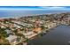 Expansive aerial view of coastal community with waterfront homes at 1903 Bayshore Dr, Belleair Beach, FL 33786