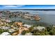 Aerial view showcasing waterfront home and neighborhood at 1903 Bayshore Dr, Belleair Beach, FL 33786