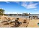 Relaxing backyard oasis with fire pit and waterfront views at 1903 Bayshore Dr, Belleair Beach, FL 33786