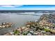 Aerial view of waterfront home with private dock and canal access at 1903 Bayshore Dr, Belleair Beach, FL 33786
