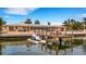 Ranch-style home on the water with private dock and jet ski at 1903 Bayshore Dr, Belleair Beach, FL 33786