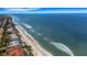 Beachfront aerial view, highlighting the pristine beach and ocean view at 1903 Bayshore Dr, Belleair Beach, FL 33786