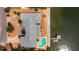 Bird's eye view of waterfront home, pool, and private dock at 1903 Bayshore Dr, Belleair Beach, FL 33786