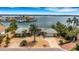 Aerial view of a single-Gathering home on the waterfront at 1903 Bayshore Dr, Belleair Beach, FL 33786