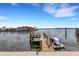 Private wooden dock with water access and jet ski lift at 1903 Bayshore Dr, Belleair Beach, FL 33786