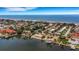 Coastal aerial showcasing neighborhood, ocean, and waterfront property at 1903 Bayshore Dr, Belleair Beach, FL 33786