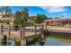 Wooden dock with seating area, overlooking the canal at 1903 Bayshore Dr, Belleair Beach, FL 33786