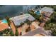 Aerial view of a waterfront home with a pool at 1903 Bayshore Dr, Belleair Beach, FL 33786