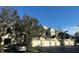 Exterior view of condo building with garages and landscaping at 5146 Northridge Rd # 209, Sarasota, FL 34238