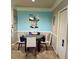 Dining area with round table and four chairs, featuring a light and airy atmosphere at 5146 Northridge Rd # 209, Sarasota, FL 34238