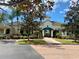 Inviting community building with landscaping and brick walkways at 5146 Northridge Rd # 209, Sarasota, FL 34238