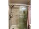 Updated shower with grab bars and a glass enclosure at 5146 Northridge Rd # 209, Sarasota, FL 34238