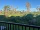 Private backyard view with lush trees and greenery at 5146 Northridge Rd # 209, Sarasota, FL 34238