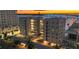 Luxury condo building with waterfront views and sunset at 226 Golden Gate Pt # 64, Sarasota, FL 34236