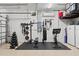 Well-equipped home gym in the garage at 7004 Highgate Ln, Bradenton, FL 34202