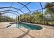 Enclosed pool and spa with patio and lush landscaping at 7004 Highgate Ln, Bradenton, FL 34202