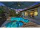 Relaxing pool and spa with covered patio and outdoor seating at 7004 Highgate Ln, Bradenton, FL 34202