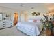 Spacious bedroom with king bed, en-suite bathroom, and ample closet space at 4050 Pinebrook Cir # 14, Bradenton, FL 34209