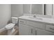 Modern bathroom with white vanity and toilet at 1704 Sunset Preserve Way, Port Charlotte, FL 33953