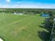 Soccer field with players and surrounding trees at 1704 Sunset Preserve Way, Port Charlotte, FL 33953