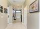 Bright hallway with tile flooring, leading to other rooms of the house at 11315 77Th E St, Parrish, FL 34219