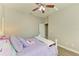 Bedroom with light purple bedding and a ceiling fan at 11315 77Th E St, Parrish, FL 34219