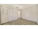 Spacious bedroom with double door closet and wood-look floors at 8212 Country Oaks Ct, Sarasota, FL 34243