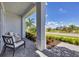 Relaxing front porch with seating area overlooking the community at 7924 Redonda Loop, Lakewood Ranch, FL 34202