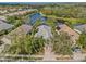Aerial view of single-Gathering home with lake access in a quiet community at 12121 Thornhill Ct, Lakewood Ranch, FL 34202