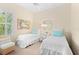 Bedroom with twin beds and a ceiling fan at 12121 Thornhill Ct, Lakewood Ranch, FL 34202