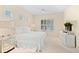 Spacious bedroom with a king-size bed, ceiling fan, and plenty of natural light at 12121 Thornhill Ct, Lakewood Ranch, FL 34202