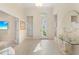 Bright and airy entryway with tile floors and a view of the backyard at 12121 Thornhill Ct, Lakewood Ranch, FL 34202