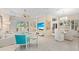 Open living space with white sofas and a large flat-screen TV at 12121 Thornhill Ct, Lakewood Ranch, FL 34202