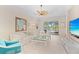 Living room with water views and a ceiling fan at 12121 Thornhill Ct, Lakewood Ranch, FL 34202