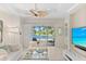 Spacious living room with sliding doors leading to a patio at 12121 Thornhill Ct, Lakewood Ranch, FL 34202