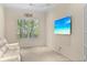 Home office featuring a comfortable couch and large TV at 12121 Thornhill Ct, Lakewood Ranch, FL 34202