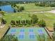 Aerial view of four well-maintained community pickleball courts at 12121 Thornhill Ct, Lakewood Ranch, FL 34202