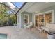 Relaxing covered patio adjacent to the pool and house at 12121 Thornhill Ct, Lakewood Ranch, FL 34202