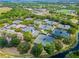 Aerial view of a community tennis complex with numerous courts at 12121 Thornhill Ct, Lakewood Ranch, FL 34202