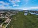 Aerial perspective of a waterfront property with lush landscaping and nearby community at 1648 Starling Dr # 202, Sarasota, FL 34231