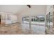 Bright living room with tile floors and pool view at 3125 Ringwood Mdw, Sarasota, FL 34235