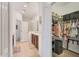 Bathroom leads to the walk-in closet. Closet has shelving for clothing and shoes storage at 317 Acerno Dr, North Venice, FL 34275