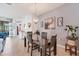 Inviting dining room featuring modern decor, stylish lighting, and access to the home's screened-in lanai at 317 Acerno Dr, North Venice, FL 34275