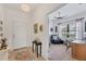Inviting entryway with tile flooring, complemented by a view into a home office at 317 Acerno Dr, North Venice, FL 34275