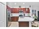 A spacious kitchen with stainless steel appliances, white countertops, and ample cabinet storage at 317 Acerno Dr, North Venice, FL 34275
