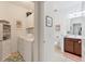 Well-organized laundry room with washer, dryer, storage cabinets and a nearby half bathroom at 317 Acerno Dr, North Venice, FL 34275
