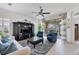 A cozy living room features a ceiling fan and sliding doors that offer views of the outdoors at 317 Acerno Dr, North Venice, FL 34275