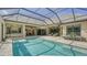 Resort-style pool with covered patio and outdoor kitchen at 8015 Bounty Ln, Lakewood Ranch, FL 34202